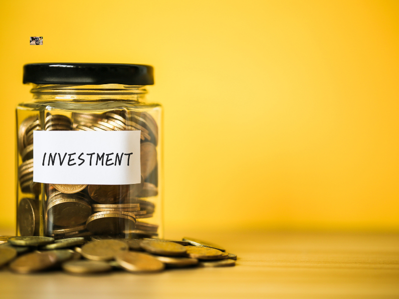 Saving coins in a jar for investment.
