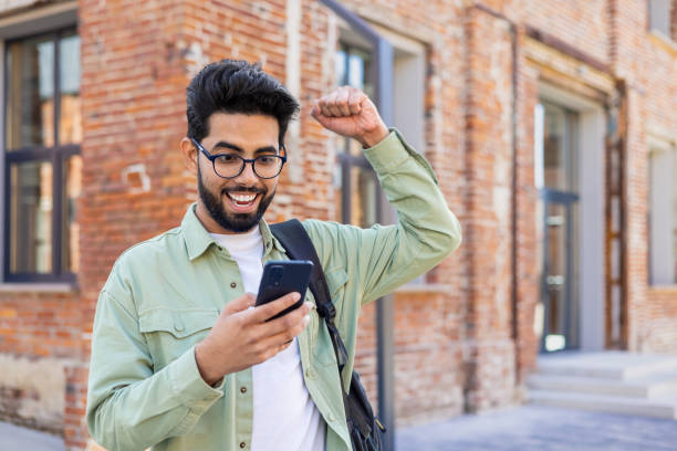 Student Finance. Happy college student celebrating financial confidence and independence
